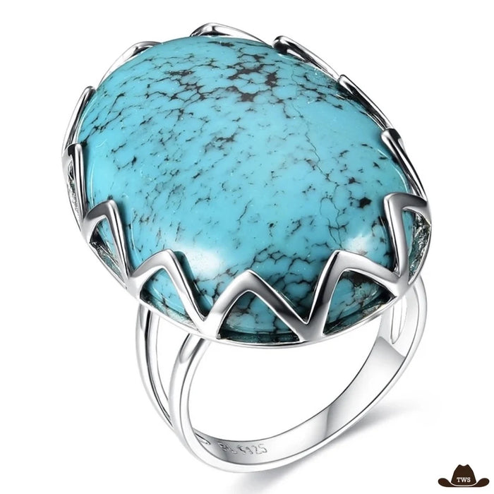 Bague argent turquoise à grand cabochon ovale moucheté de noir, tenu par une couronne de griffes en zigzag, poinçon 925