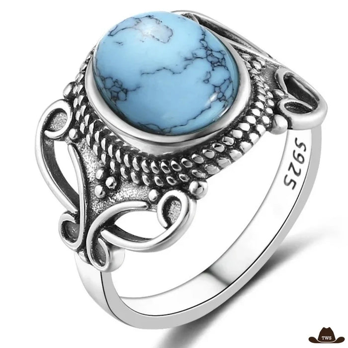 Bague turquoise argent 925, cabochon ovale veiné de noir dans un entourage perlé et volutes ajourées, poinçon 925 visible