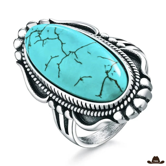 Bague turquoise argent femme, long cabochon ovale veiné de noir dans une monture d'argent ciselée de volutes et de perles