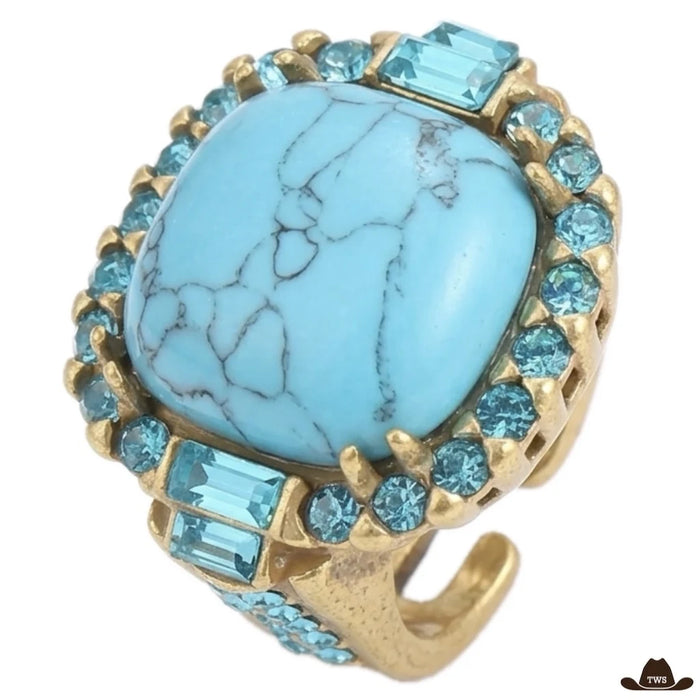 Bague turquoise femme dorée, cabochon carré veiné de gris entouré de strass bleus et de baguettes, anneau ouvert serti