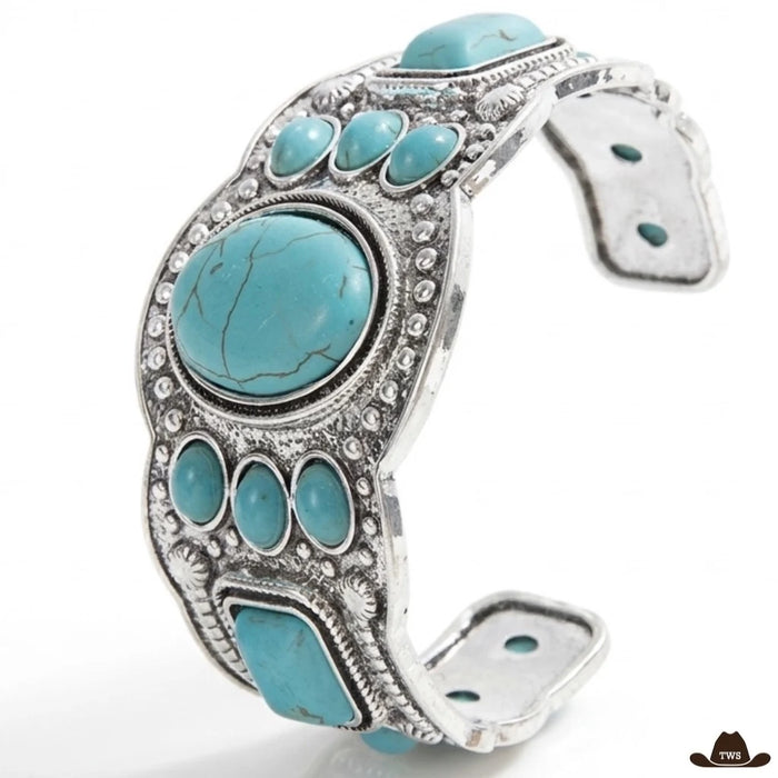 Bracelet turquoise navajo en manchette ouverte, grand cabochon ovale entouré de pierres turquoise sur métal couleur argent